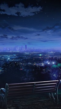 Ławka z widokiem na panoramę miasta nocą