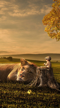 Leżący lew i chłopczyk na pieńku