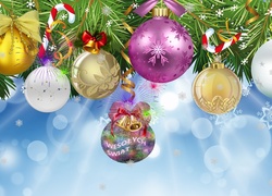 Bombki i ozdoby na gałązce z życzeniami świątecznymi