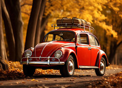 Czerwony Volkswagen Garbus pod jesiennymi drzewami