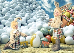 Dzieci przebrane za króliczki malują jajka