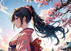 Dziewczyna w kimonie na tle nieba i okwieconych gałązek