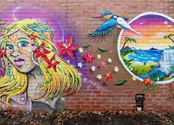 Street art z kobietą i ptakiem