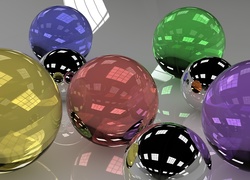 Kolorowe szklane kule w grafice 3D