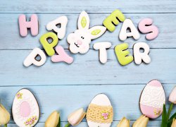 Napis Happy Easter z pisankami i tulipanami
