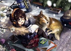 Pies obok dziewczynki z książkami
