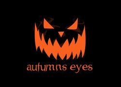 Pomarańczowy napis autumns eyes na czarnym tle