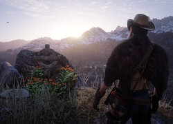 Postać w górach z gry Red Dead Redemption 2