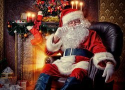 Święty Mikołaj w fotelu przy kominku