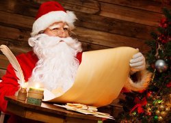 Święty Mikołaj z listą prezentów