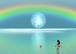 Tęcza nad morzem i kobieta grającą w piłkę plażową