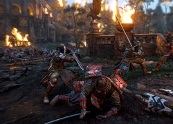 Walka rycerzy z samurajami w grze For Honor