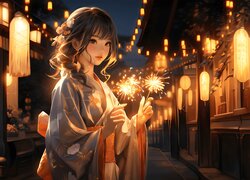 Dziewczyna w kimono ze sztucznymi ogniami