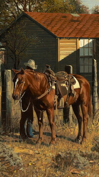 Jeździec przy koniu na pastwisku