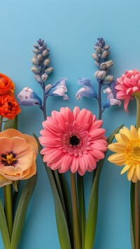 Kolorowe kwiaty na niebieskim tle