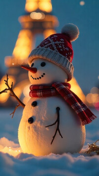 Oświetlony bałwanek w czapce i szaliku na śniegu