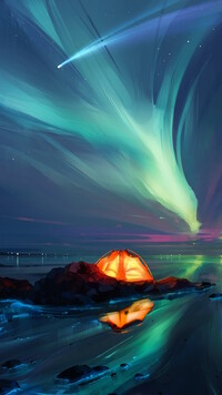 Oświetlony namiot na brzegu morza