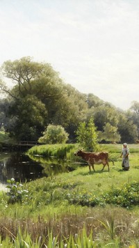 Pasterka z krówką na łące przy rzece