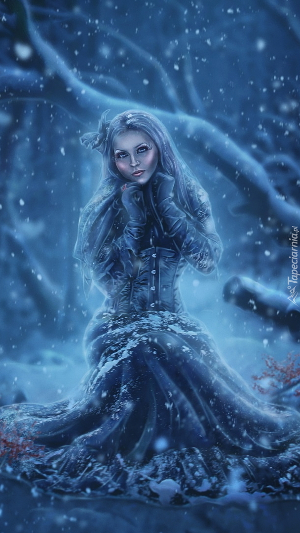 Kobieta zimową porą w lesie