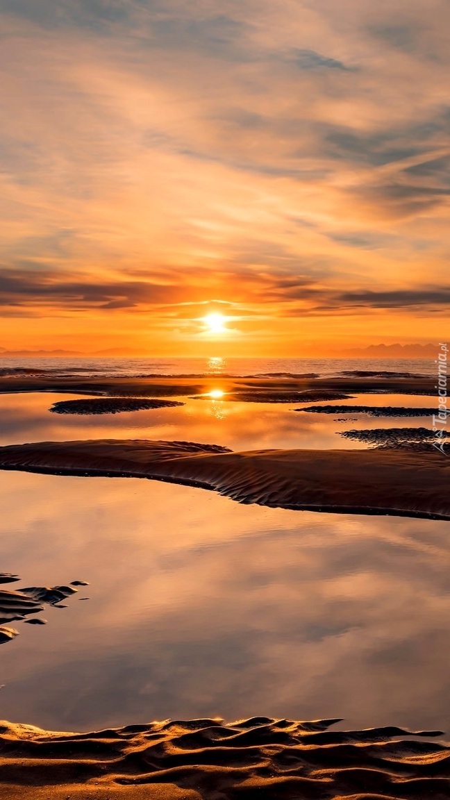 Plaża o zachodzie słońca