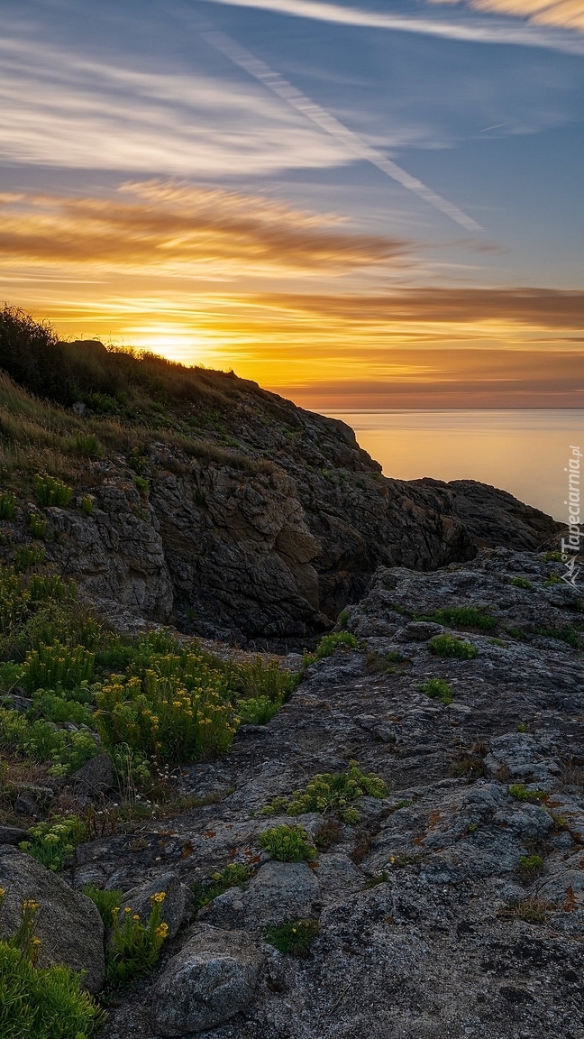 Skały Pointe de la Varde o zachodzie słońca