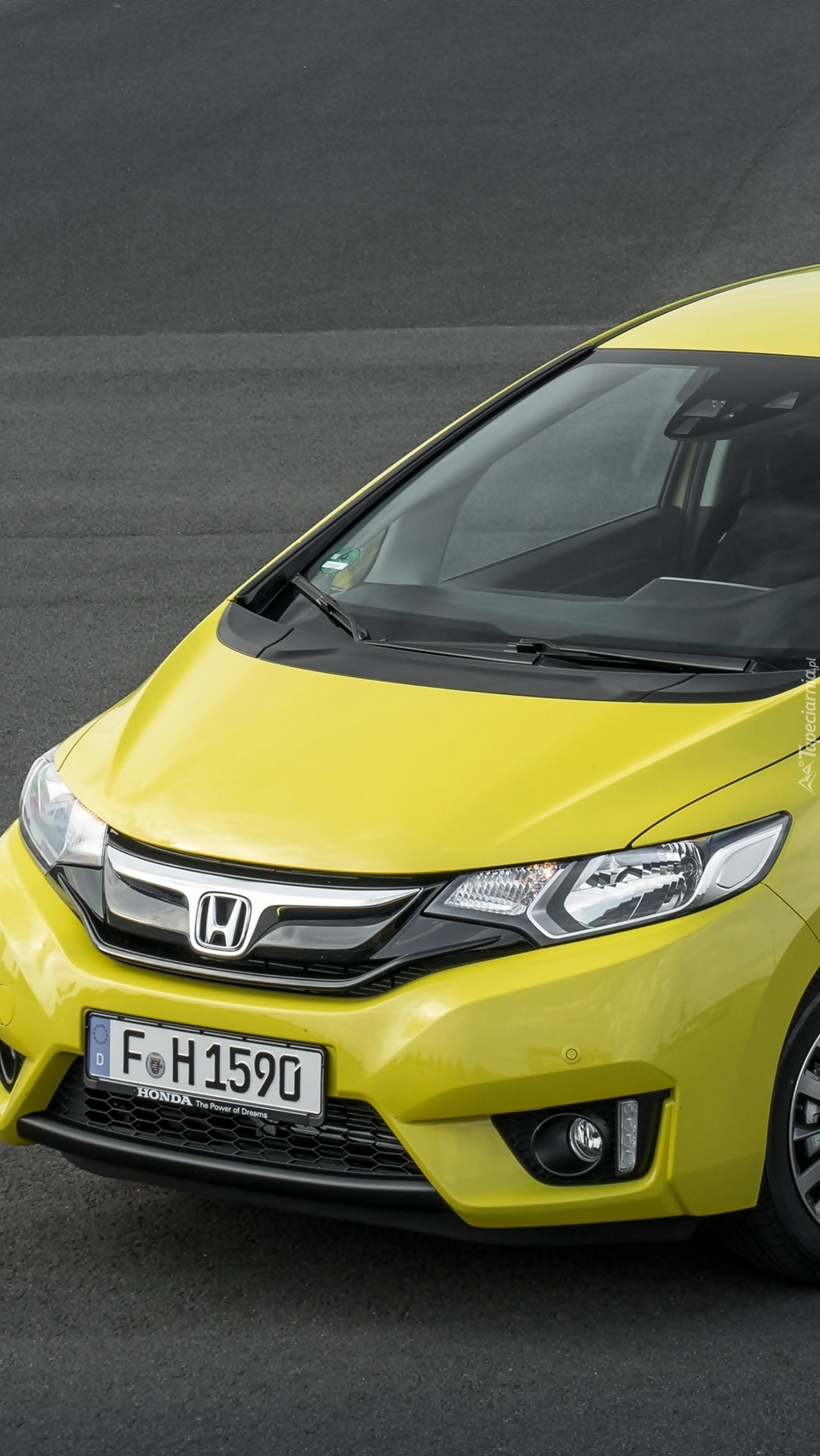 Żółta Honda Jazz