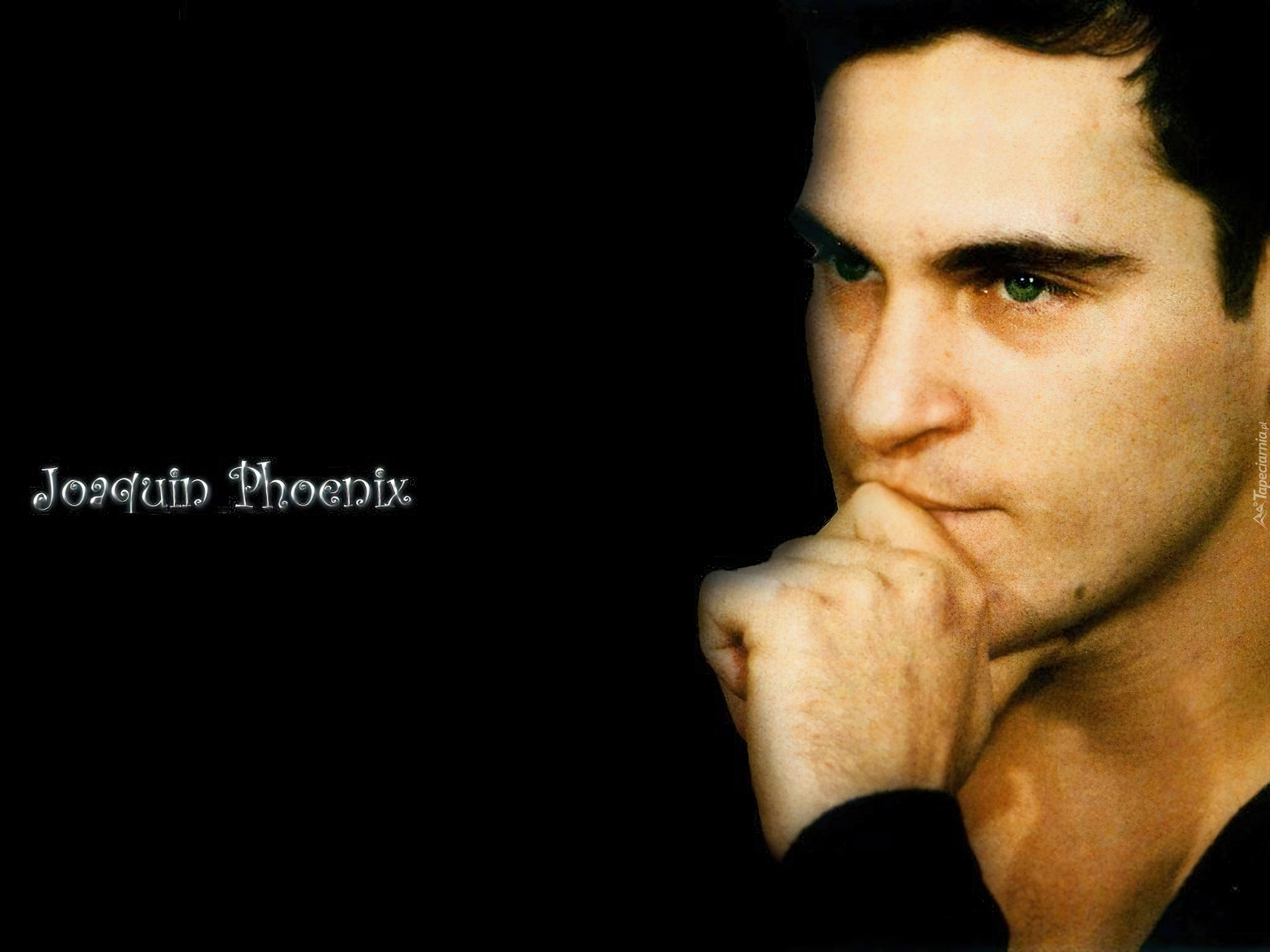 Joaquin Phoenix,niebieskie oczy, ręka