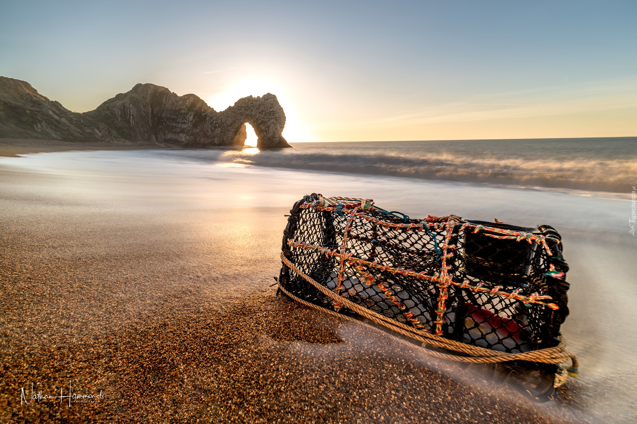 Wybrzeże Jurajskie, Łuk wapienny Durdle Door, Wschód słońca, Morze, Skały, Plaża, Kosz, Hrabstwo Dorset, Anglia