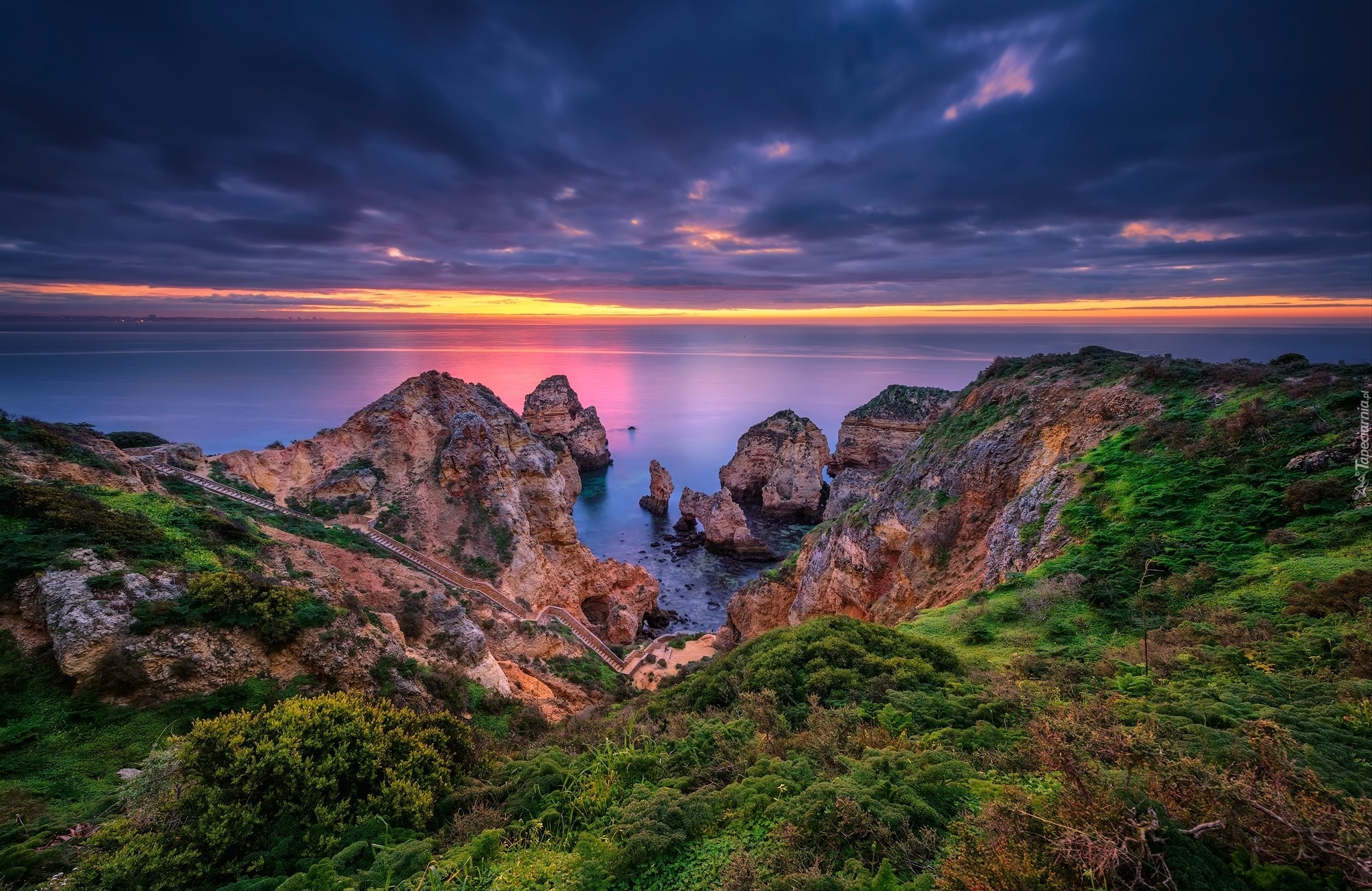 Portugalia, Region Algarve, Cypel Ponta da Piedade, Morze, Skały, Zachód słońca