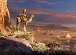 Bayek na wielbłądzie w Egipcie z gry Assassins Creed: Origins 