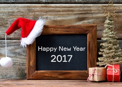 Choinka z prezentami i życzenia noworoczne 2017 na tablicy