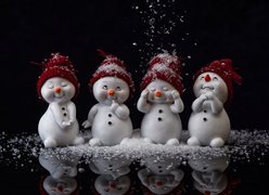 Cztery bałwanki z płatkami śniegu