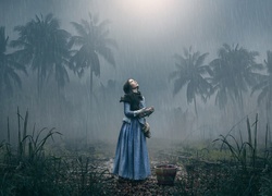Deszcz zaskoczył dziewczynę w palmowym lesie