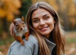 Dziewczyna z wiewiórką na ramieniu