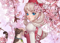 Dziewczynka z kotem wśród kwitnących wiśni