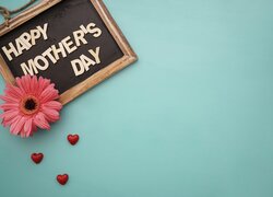 Gerbera na tabliczce z napisem Happy Mothers Day