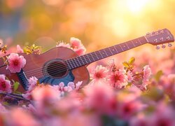Gitara leżąca wśród różowych kwiatów