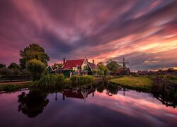 Holandia, Wiatrak, Domy, Rzeka, Drzewa, Zachód słońca, Skansen Zaanse Schans