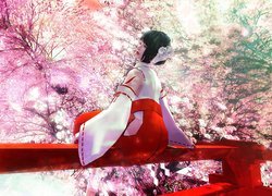 Japonka wśród kwitnących drzew