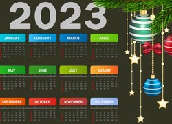 Kalendarz na 2023 rok obok bombek na gałązkach
