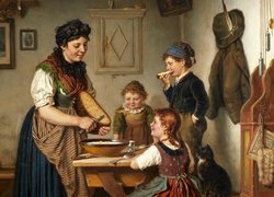Kobieta i dzieci przy kuchennym stole