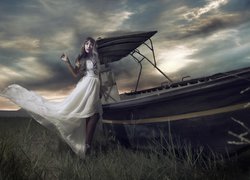 Kobieta w białej sukni przy łódce