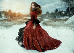 Kobieta w długiej sukni na leśnej polanie w prószącym śniegu