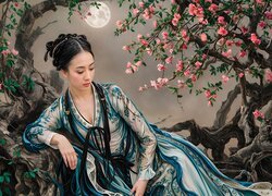 Kobieta w stroju hanfu pod ukwieconymi drzewami