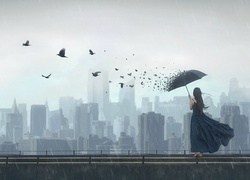 Kobieta z parasolką i lecące ptaki