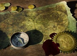 Kompas i monety na mapie