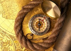 Kompas i sznur położone na mapie