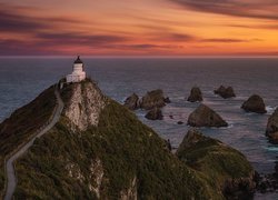 Morze, Zachód słońca, Latarnia morska, Nugget Point Lighthouse, Skały, Chmury, Nowa Zelandia