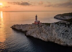 Zachód słońca, Latarnia morska Punta Carena, Morze, Skały, Wyspa Capri, Anacapri, Włochy