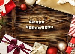 Napis Merry Christmas i prezenty